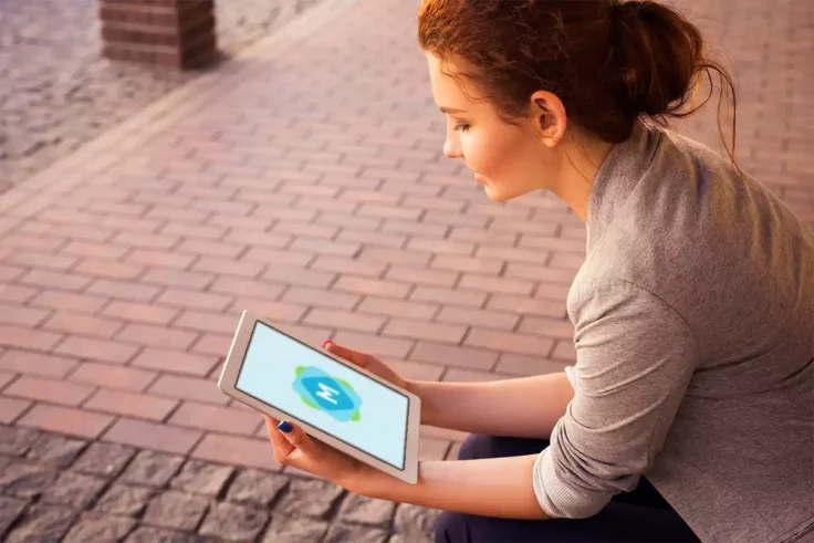 View Information about Woman Holding iPad Mockup